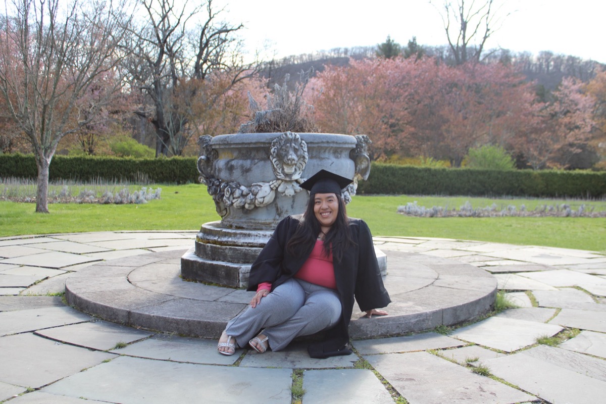 Graduate portrait under spring blossoms